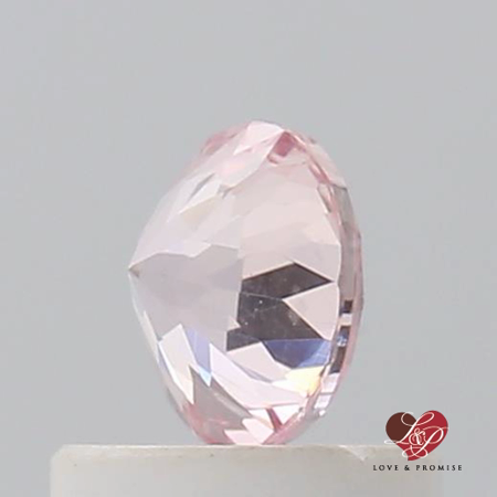 0.64cts Round Warm Peachy Rose Champagne Sapphire 