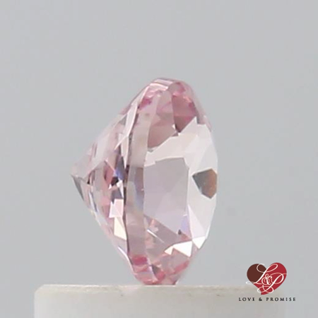 0.64cts Round Warm Peachy Rose Champagne Sapphire 