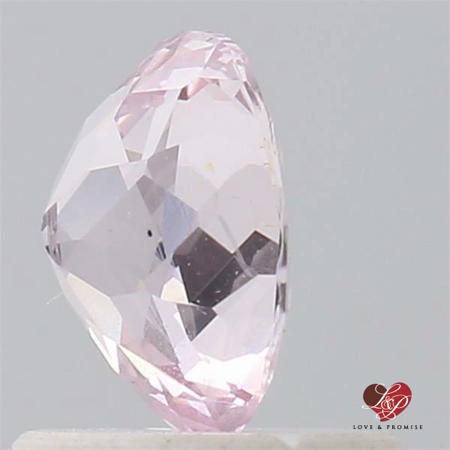 0.92cts Oval Peachy Pink Champagne Sapphire