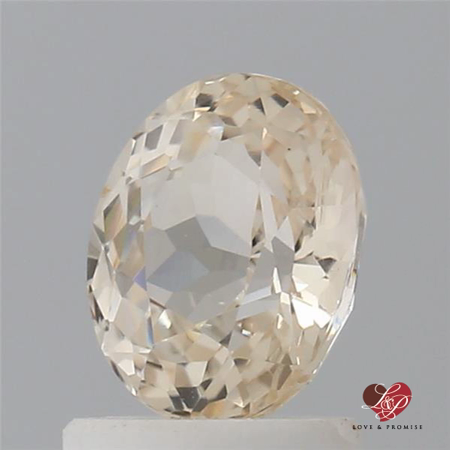 1.43cts Oval Faint Icy Peach Butter Champagne Sapphire 