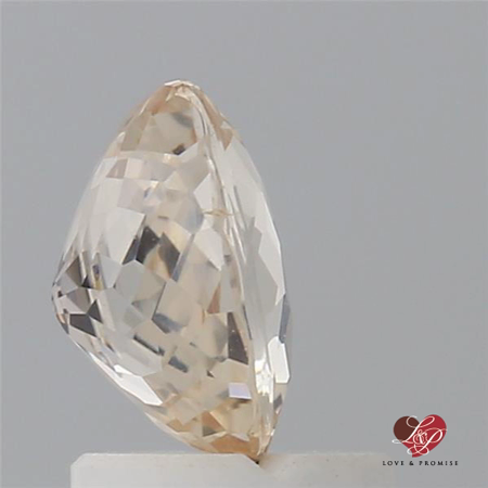 1.43cts Oval Faint Icy Peach Butter Champagne Sapphire 